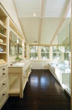 Simplicity, transparency, and plenty of elbow room allow this master bath to live even larger than its dimensions suggest.