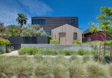 The two-tone design breaks up the massing of the residence. A vegetable garden is featured
predominantly at the front of the house, reflecting the clients desire for a healthy, simplistic lifestyle.