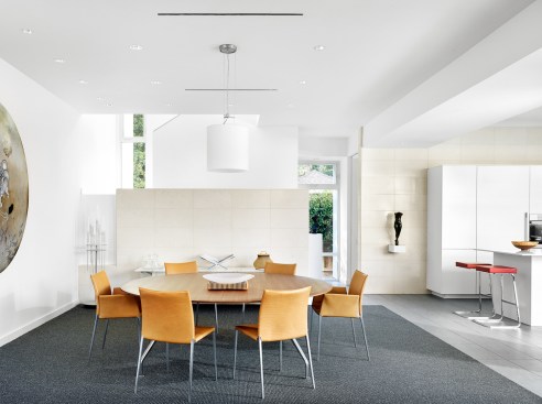 Dining area with stair beyond and kitchen