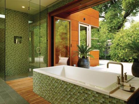The homes study, clad in wood composite panels, creates a protected courtyard that acts as an al fresco extension of the master bath. 