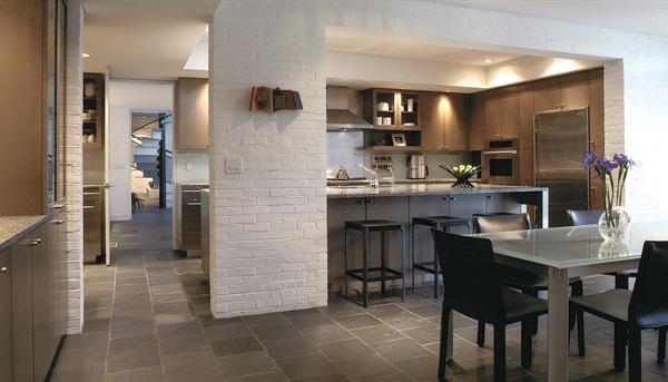 The kitchen's footprint didn't change, but it looks and feels bigger than the original, thanks to a raised ceiling and reconfigured plan.