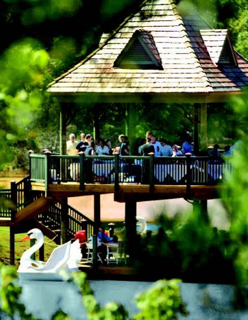 SWAN LAKE: "Soft programming" allows prospective buyers to sample the lifestyle of a community for an afternoon. This party on a bandstand and boat dock near Atlanta is one such example.