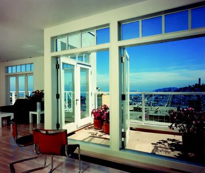 BAY SIDE: All three units that make up 1055 Lombard Street (above) in San Francisco, the Project of the Year in 1987, are afforded dramatic views of the city and bay beyond thanks to horizontal bands of windows and glass doors kept in scale by a ribbon of clever clerestory units.