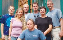 Michael Chandler (front center) offers a flexible profit-sharing plan to promote staff loyalty and profit consciousness.