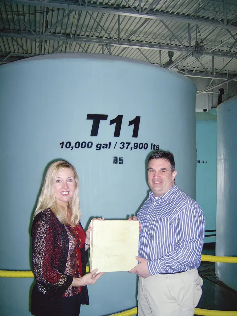 A Green Alternative Poly-Green's COO Jeff Schultheis (right) and director of business development Stephanie Malas hold a sample of hard insulation made from the biopolyol their company's plant produces.