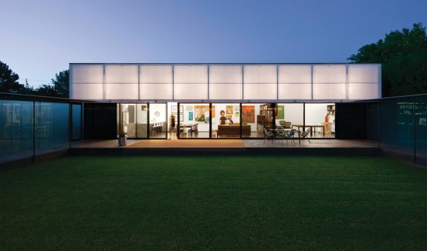 This translucent, operable awning also serves as a building-width light fixture.