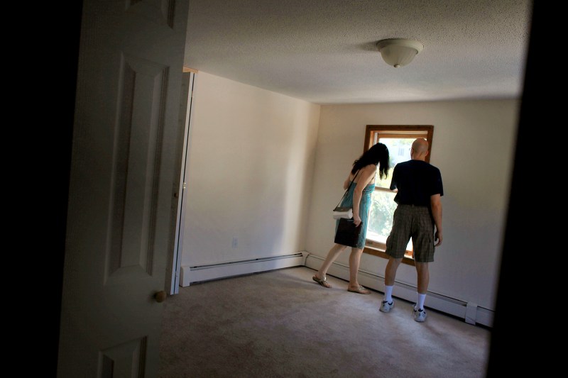 ANSONIA, CT - AUGUST 29: People look at a foreclosed home on August 29, 2010 in Ansonia, Connecticut. The home was one of numerous foreclosed homes on a bus tour organized by realtor Frank Hoinsky.Hoinsky has given over three of the tours which last for approximately three hours and stop at foreclosed homes in the lower Naugatuck Valley in Connecticut. As the American economy continues to struggle, housing prices are at an all-time low. Currently an estimated 1.65 million homes are in the foreclosure process in America.  (Photo by Spencer Platt/Getty Images)