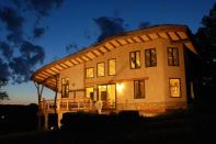 A home built using round timber from Whole Trees LLC.
