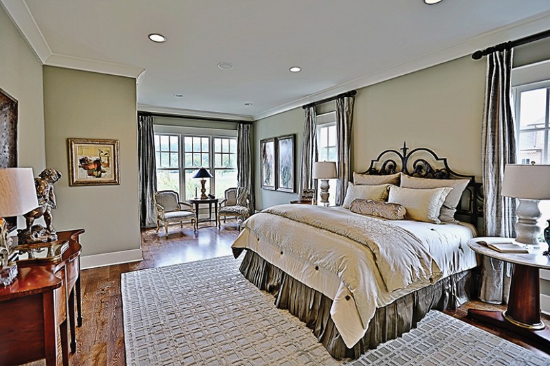 Main-level master suites are popular, like this one from plan HWBDO11991. See more images, information, and the floor plan. Photo by Carolyne Raney, Simply Irresistible Photography.