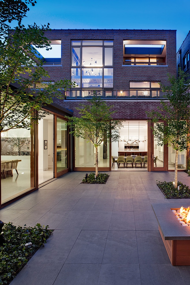The historic storefront of a Chicago commercial office was converted into a luxury residence by local firm Vinci-Hamp using direct-set windows from Grabill Architectural Windows & Doors.