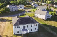 An overhead view of Brookside Development's Singer Village community. The Historic Singer Home is visible in the upper left.