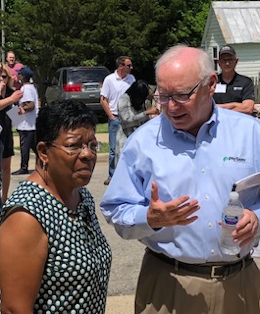 Raleigh homeowner Linda Williams and Ply Gem chairman/ceo Gary E. Robinette