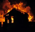 An old Wooden house burning in the fire