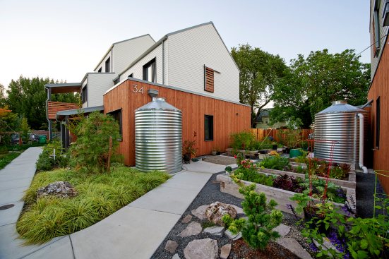 Three large rain cisterns can store up to 3,600 gallons of water, which is used to irrigate the community’s garden and landscaping needs.