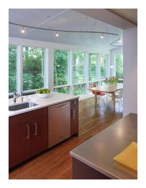 The+kitchen+includes+two+work+islands%2c+a+kitchen+office%2c+and+a+dining+area.+The+second+island%2c+near+the+window-wall%2c+has+a+second+sink%2c+as+well+as+chairs+for+bar-style+seating.+The+dining+area+is+to+the+right.
