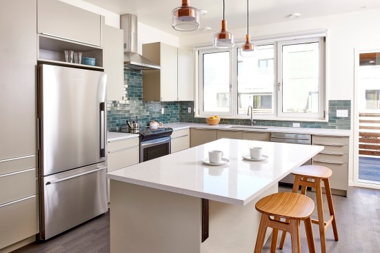 Inside, residents will find an open floor plan with a combined kitchen, dining, and living space and large, triple-paned windows to let in natural light.