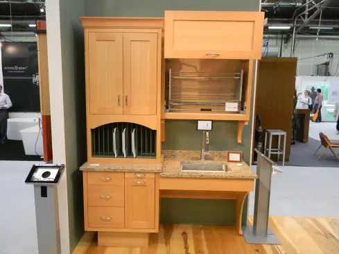 The company now offers its Universal Access cabinet package as part of any kitchen design. Highlights include touch-open hardware, cabinets at different heights, and angle sink cabinets to accommodate a wheelchair. Shown here in fir, the line can be ordered in any style and almost any specie the company offers. 
www.crown-point.com.