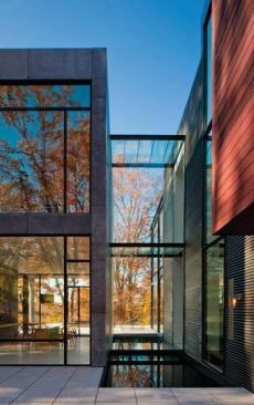 A glass bridge over a pool joins this modernist home’s two main sections, which gives those passing through the feeling that they are suspended in the air. Project: Bloom House, Glen Echo, Md.; Architect: Robert M. Gurney, Washington, D.C.; Builder: Bloom Builders, Bethesda, Md.