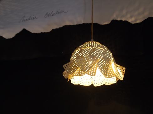 Nadia Belalia's&nbsp;repurposed folding steamer baskets are fused together to make a hanging fixture.