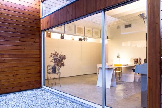 The bedroom abutting the interior court easily flexes for use as a home office. “I used the second bedroom as my office and with the garage door open could see through to the street with my neighbors walking by, the ice cream man, and kids on bikes,” Baum says. “It was great fun.”