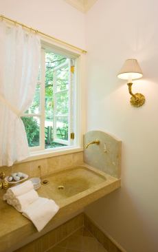 The homeowners have happy memories of their travels in Italy, and they wanted a sink that would remind them of the drinking fountains common to Roman piazzas. This limestone sink and its playful brass spout did the trick nicely. Project: Conrad Poor Residence, Maplewood, N.J.; Architect/Interior Designer: Marvin Clawson, Clawson Architects, Maplewood, N.J.; Builder: Venancio Ribeiro, COTA Corp. General Contractor, Newark, N.J.