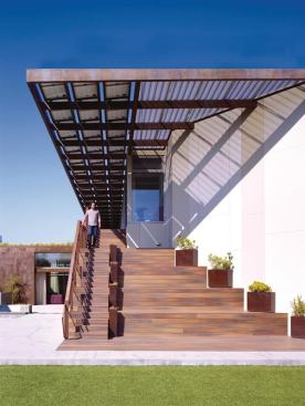 Rather than havingthe solar panels look like a tacked-on afterthought, this design incorporates a 12kW solar array into a punched-out metal overhang. It fits seamlessly into the home’s modern aesthetic while creating a play of shadow and light.   
Project: Yin-Yang House, Venice, Calif.; 
Architect: Brooks + Scarpa
