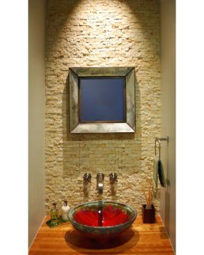 This infill house in Houston is sleek and modern, but a red fired-clay sink in the powder room adds a surprising, hand-hewn accent. Project: 4412 Effie, Bellaire, Texas; Architect/Interior Designer: Edward Dumont, Studio RED Architects, Houston, Texas; Builder: Les Albin, Lacon Homes, Houston, Texas.
