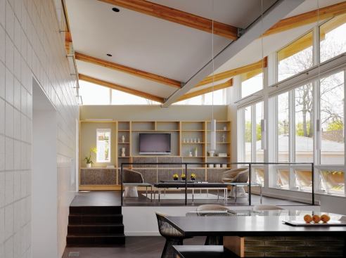 Concrete floors and a concrete block mass wall serve as passive thermal flywheels.