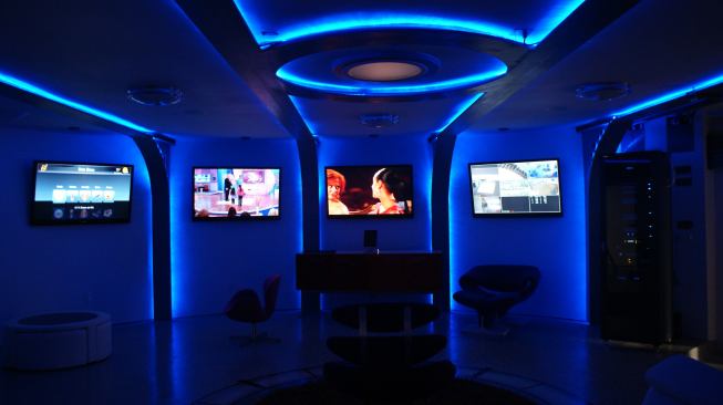 Blue LED lighting and space-age lines give the home's 'command center' a sci-fi vibe.