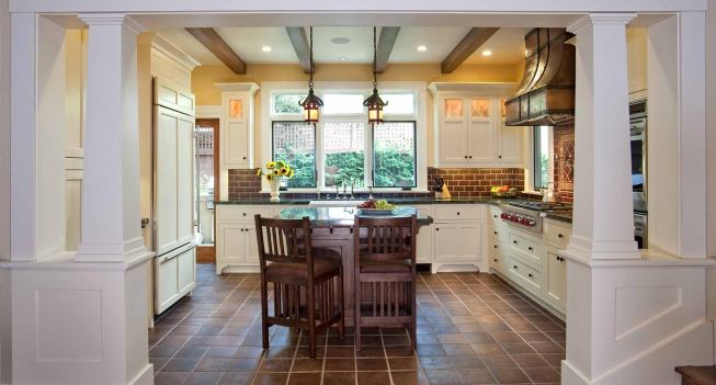 Grand, Custom Home Under 4,000 square feet. Builder: Hill Construction Company. Architect: IS Architecture. Unique touches in the kitchen include quarter sawn oak exposed joists, a handmade copper and iron hood fa&ccedil;ade and antique lighting fixtures.