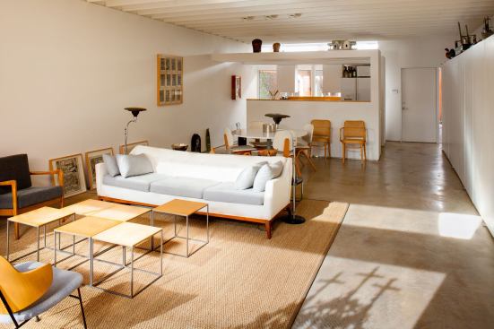 All of the storage in the house is along the party wall. Baum left the storage modules empty, but installed tracking for closet systems. “We used that as a special sales feature,” he explains, “because people could customize their storage for anything from bicycles to clothes to file cabinets.”