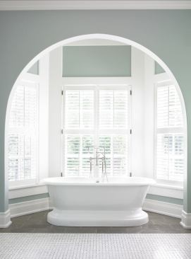 This freestanding bathtub is in synch with this home’s English manor feeling, but there’s nothing old-fashioned about its modern functionality and green sensibility. Architect: Frank Neely, Frank G Neely Design Associates Builder: Mike Hammersmith