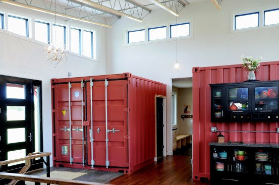 Shipping container serves as coat closet and powder room