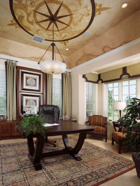 THINK TANK: Designed as an appendage to the floor plan, the study/den is a quiet spot, far removed from the frenetic core of the home. Its location adjacent to the front entry means clients can stop by for meetings without encountering the rest of the house. A faux painted ceiling by Artistic Projects of Boynton Beach, Fla., gives the space a touch of Old World flair.