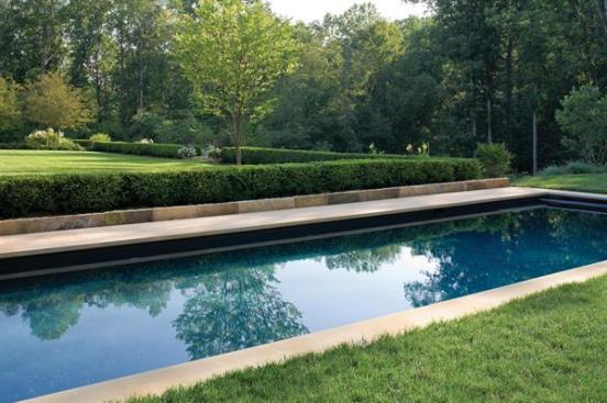 Boxwood hedges framing the east and west lawns lend tidy year-round structure