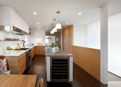 After: Taking down walls and replacing interior walls with translucent glass allows the new kitchen to be filled with light.