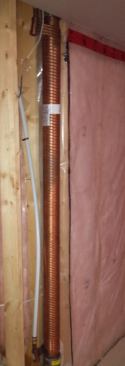 The Power-Pipe from Renewability Energy, located inside the garage wall, extracts energy from hot water that has gone down the drain.
