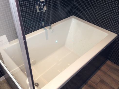 Launching in March 2013, Aquatic's Serenity Drift bath uses unique technology to offer gentle massage. Rather than air, the jets move water through the tub for "effervescence" without the noise and impact of bubbles. The water is circulated over the tub's motor to capture more heat and dampen the motor sound.