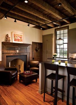 New, painted kitchen cabinets contrast with the original woodwork.