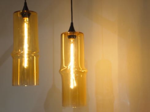 The forms in Off-Centre’s vessels and pendant lights (shown) hint at movement and softness.