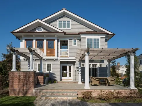 The pergola on the home's south elevation is made of cedar, and wisteria has been planted.