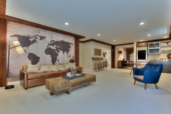 The basement of the home includes a bedroom, bathroom, and a large rec room with wet bar.