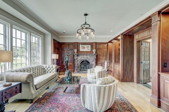 The library’s marble mantel is from a home in Philadelphia, while the cabinets were sourced from Washington, D.C.