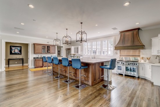 The kitchen island countertop is 100-year-old pine beams rescued from the Maryland Chemical Co. warehouse in Baltimore.