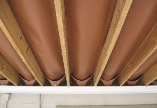 Trex RainEscape Made with rugged plastic and ultraviolet inhibitors, the RainEscape Deck Drainage System of downspouts and troughs diverts water to a rain gutter and away from the space below, creating an indoor environment outdoors. Along with providing a dry area for furniture, the firm says fixtures such as ceiling fans, speakers, and video electronics may be safely installed beneath the system.&nbsp;