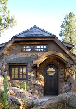 Mountain Cottage in Golden, Colo., is by TKP Architects and Old Greenwich Builders. Though it's new construction, the cottage takes its cues from the century-old bungalows that came before it. Details like an eyebrow entry, grid dormers, hefty corbels, a hip roof, slate shingles, and stone walls hold timeless appeal. It's a good bet they always will.