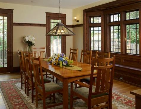New wood detailing and and French doors enhance the room's natural warmth and connection to the outdoors. The chandelier was found in an antique store.