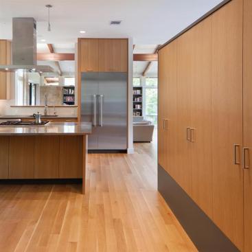 The kitchen features white oak flooring and CARB-compliant plywood cabinets. Metal ductwork was force-ventilated before move-in to eliminate particulates and remnant off-gassing.