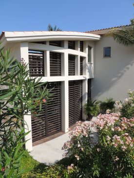 Iron+shutters+to+protect+interior+courtyard+but+allow+the+ocean+breezes+to+penetrate+the+home