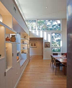 Light filters into the home from every angle; built-in architectural features enhance the interior design. 